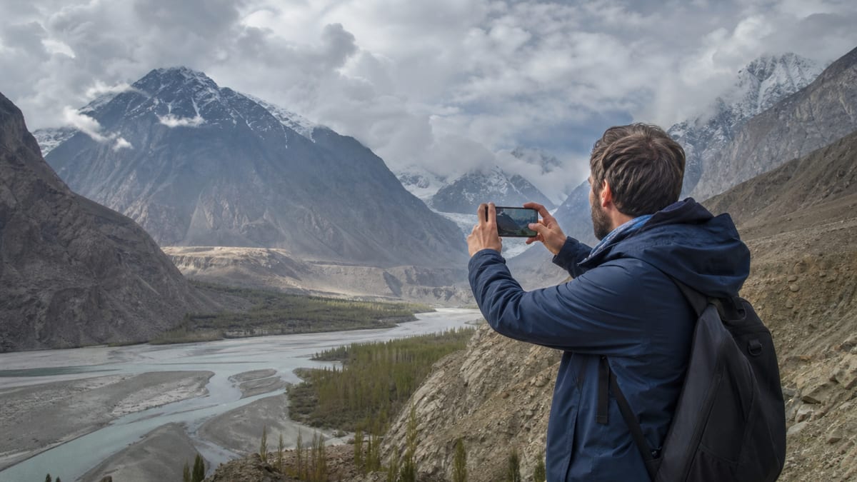 Illustrative editorial tourism scene representing Photography restrictions in Gilgit-Baltistan
